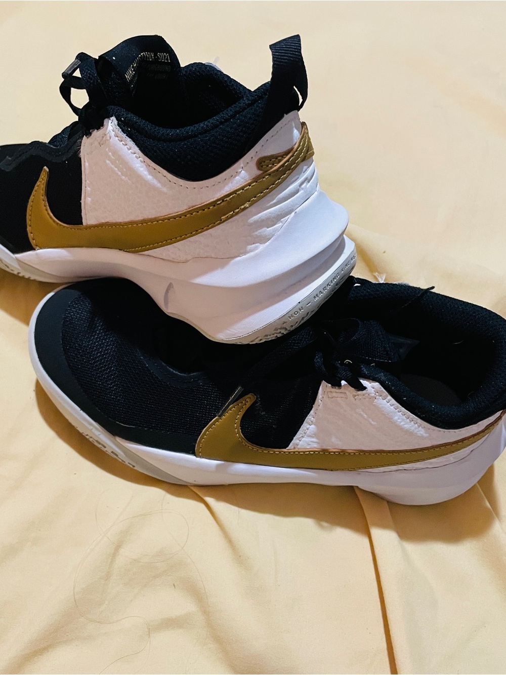 Nike Hustle Black & White with Gold Swoosh Athletic Sneakers Youth 4